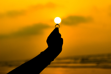 a ring positioned at the sun to be its stone. with space for textの写真素材