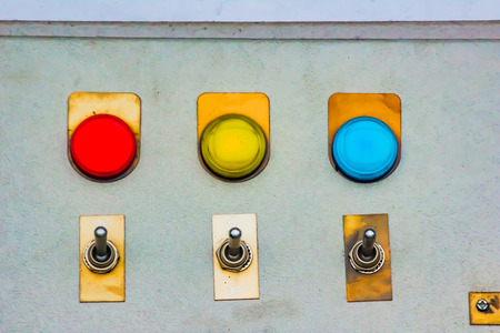 red yellow blue lights indicator with changeover metal switch on a steel board panel