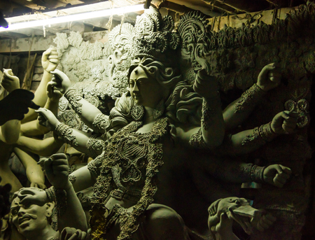 Kumartuli,West Bengal, India, July 2018. A clay idol of Goddess Durga under construction at a shop....
