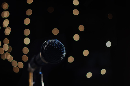 singing mic on a black background with space for textの写真素材