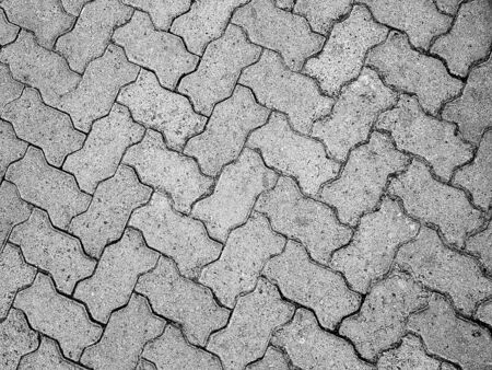 black and white rough cement wall texture with cracks, a background patternの写真素材