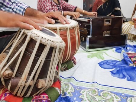 close up image of musician hand playing tabla, an indian classical music instrument with focus on...