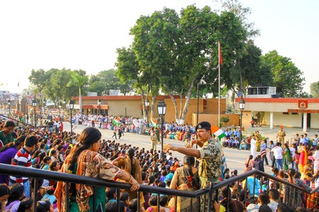 August 15,2018, Wagha Border, Amritsar, India. Indian crowd cheering and celebrating Indian Independance day event performed by Border Security Force of Indian Army at Wagha Border, India.のeditorial素材