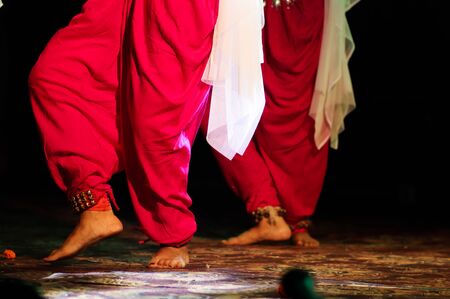 indian classical dance form in feet with musical anklet with selective focus and blurの写真素材