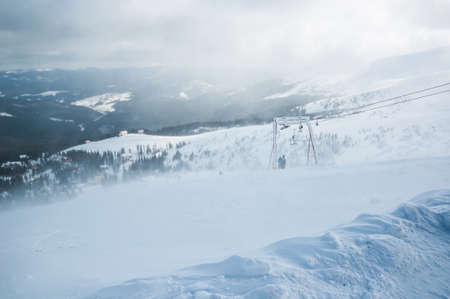 Winter trees in mountains covered with fresh snow.の写真素材