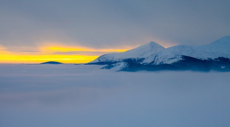 Majestic sunset in the winter mountains landscape. Dramatic sky.の写真素材
