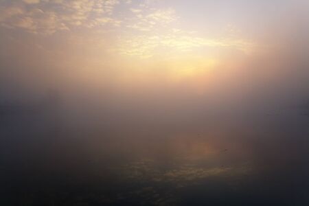 Lake with the fog at sunrise. The Ukraineの写真素材