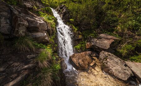 Beautiful small waterfall In Mountains, Ukraine. The  White water waterfall.の写真素材