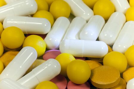 Many different colorful medication and pills from above.