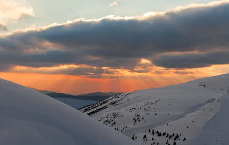 Fantastic evening winter landscape. Dramatic overcast skyの写真素材