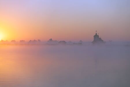 Beautiful sunrise over Church. Ukraineの写真素材
