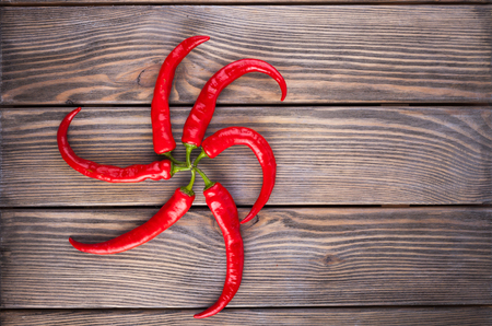 The set of red vegetables on wooden table, copy space imageの写真素材