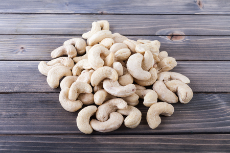 Cashew nut on wooden backgroundの写真素材