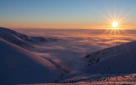 Colorful winter sunrise in the mountains.の写真素材