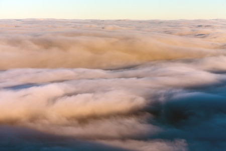 Sun over winter mountains, covered with snowの写真素材