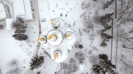 St. Michael Vydubitsky male monastery in Kiev, Ukraine. Flying on copter over the church against the backdrop of the city of Kiev and the Dnieper River . Aeril viewの写真素材