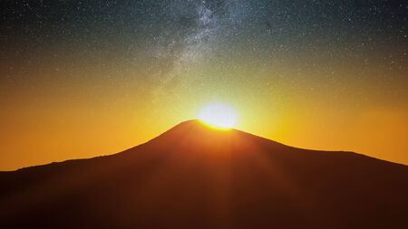 Fantastic landscape glowing by sunlight. Natural park. Carpathian, Ukraine, Europe. Beauty world. Happy New Year! day and night collage landscape.の写真素材