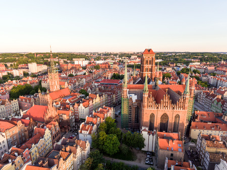 Photo of the old town of Gdansk architecture in sunset light. Aerial shot. Channel and buildings -...
