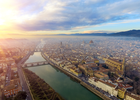 AERIAL. Panorama of the city of FLORENCE in Italy with the dome and Palazzo della Signoria and arno riverの写真素材