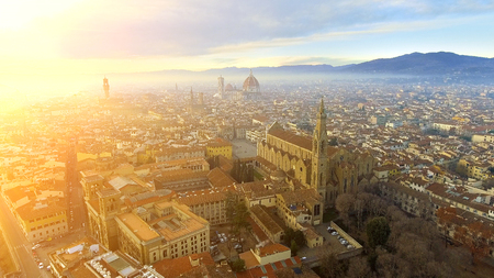 AERIAL. Panorama of the city of FLORENCE in Italy with the dome and Palazzo della Signoria and arno riverの写真素材