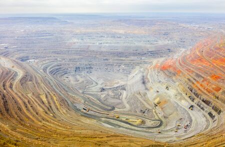 Aerial view of opencast mining quarry with lots of machinery at work - view from above.の写真素材
