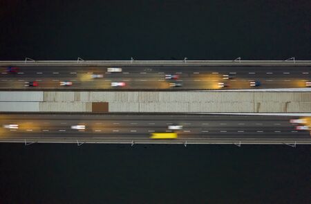 Rising drone shot reveals spectacular elevated highway, bridges, transportationの写真素材