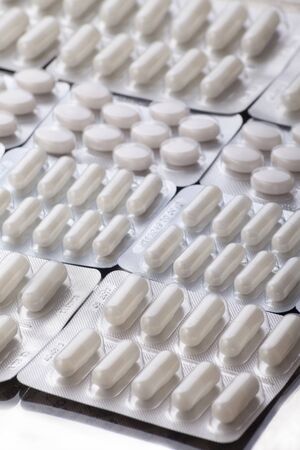Pharmacy theme, Heap of white round medicine tablet antibiotic pillsの写真素材