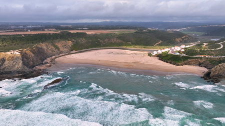 Aerial view of Praia de Odeceixe along Ribeira de Seixe river, Odeceixe, Faro, Portugal.の写真素材