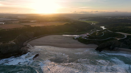 Aerial view of Praia de Odeceixe along Ribeira de Seixe river, Odeceixe, Faro, Portugal.の写真素材