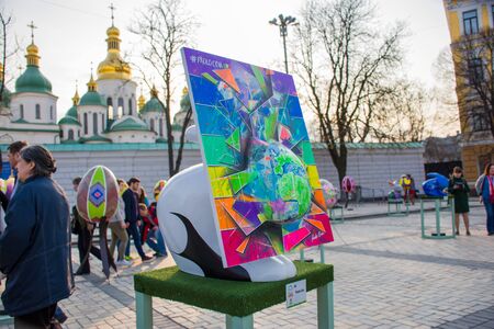 Creative art installation Easter white rabbit with multicolored rectangular painting, passing through muzzle hare, turning it into different color. Beautiful art .Kyiv (Kiev), Ukraine, april 2018のeditorial素材