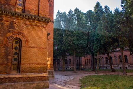 The inner courtyard of the Church of Three Saints in the rays of the morning sun. Architecture...