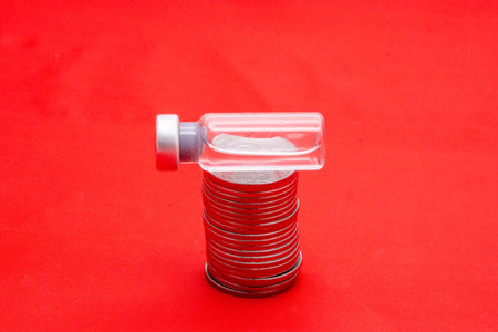 Plastic bottle on red background. Plastic bottle with plastic cap.