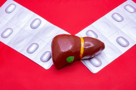 Heart shape and pills on red background. Health care and medical concept.の写真素材