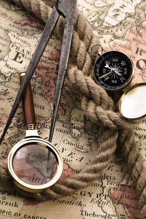 Old compass on map