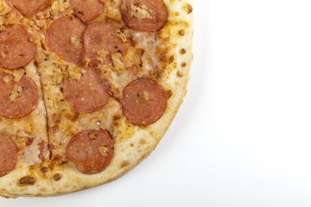 A couple of delicious pizzas, with raw tomatoes, green peppers and salamiの写真素材