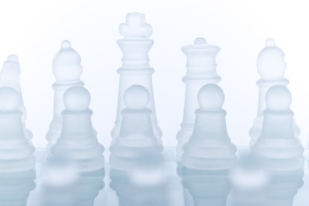 Beautiful glass chess on a white background. Photo taken in the studio on a glass countertop.の写真素材