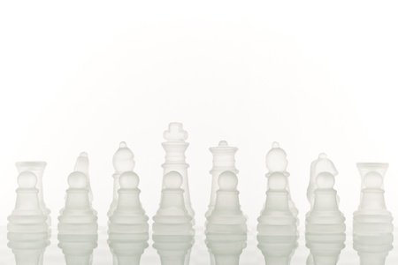 Beautiful glass chess on a white background. Photo taken in the studio on a glass countertop.の写真素材
