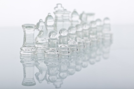 Beautiful glass chess on a glass countertop.の写真素材