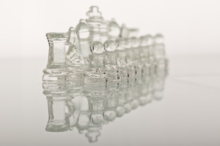 Beautiful glass chess on a glass countertop.の写真素材