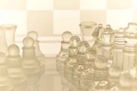 Gass chess on a glass countertop.Checkerboard is the background image.の写真素材