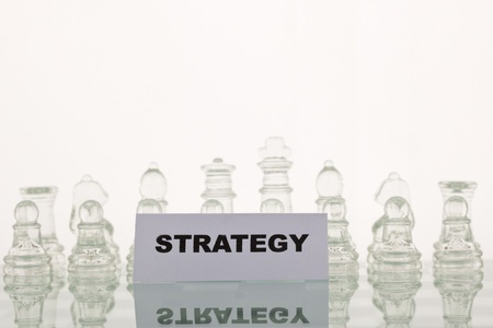 The concept of a good strategy. Beautiful glass chess on a white background.の写真素材