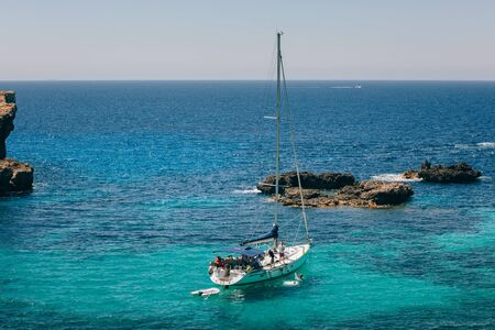 Sailing yachts in the beautiful Blue Lagoon on Comino Islandのeditorial素材