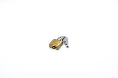 Padlock next to the key on white background.
