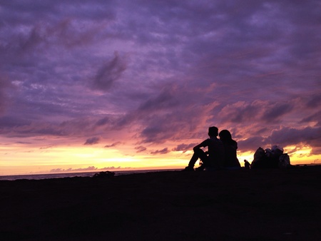 silhouette of couple with the purple sky