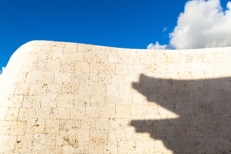 The interesting shape of shadow on the smooth curve rampartの写真素材