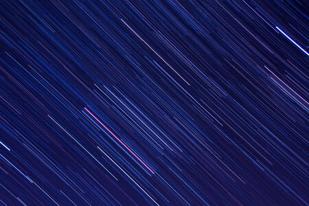 Abstract background with; Orion star trails in the night skyの写真素材