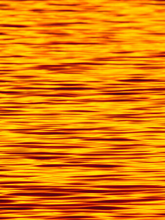 Texture image of the surface of the sunset lake の写真素材