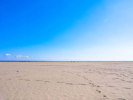 Shining blue sky, sea and sand beachの写真素材