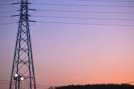 Electricity tower and lines at sunset, Japanの写真素材