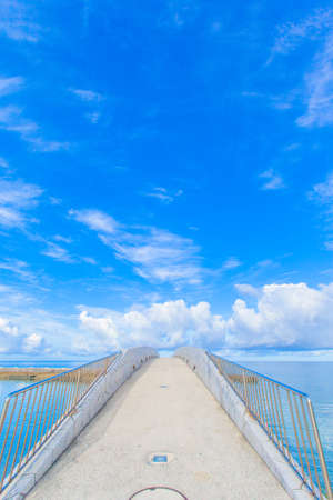 Arched bridge over the seaの写真素材
